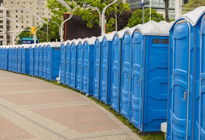 a row of sleek and modern portable restrooms at a special outdoor event in Corrigan TX